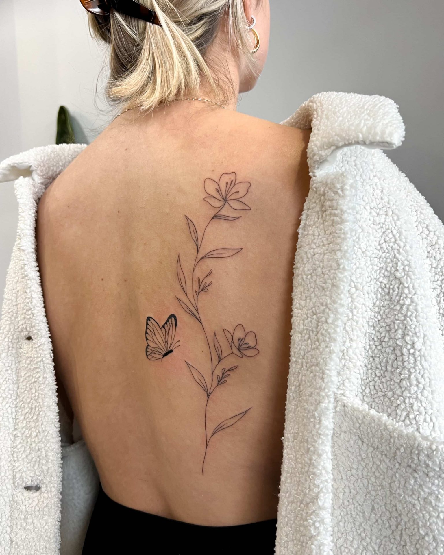 back flower tattoo marigolds