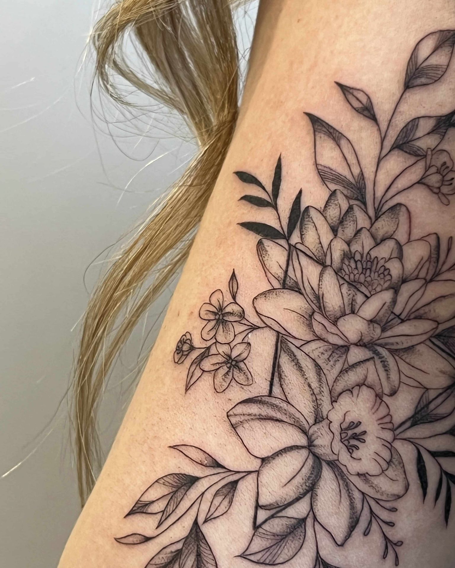 flower bouquet of narcisses, marigolds, daisy